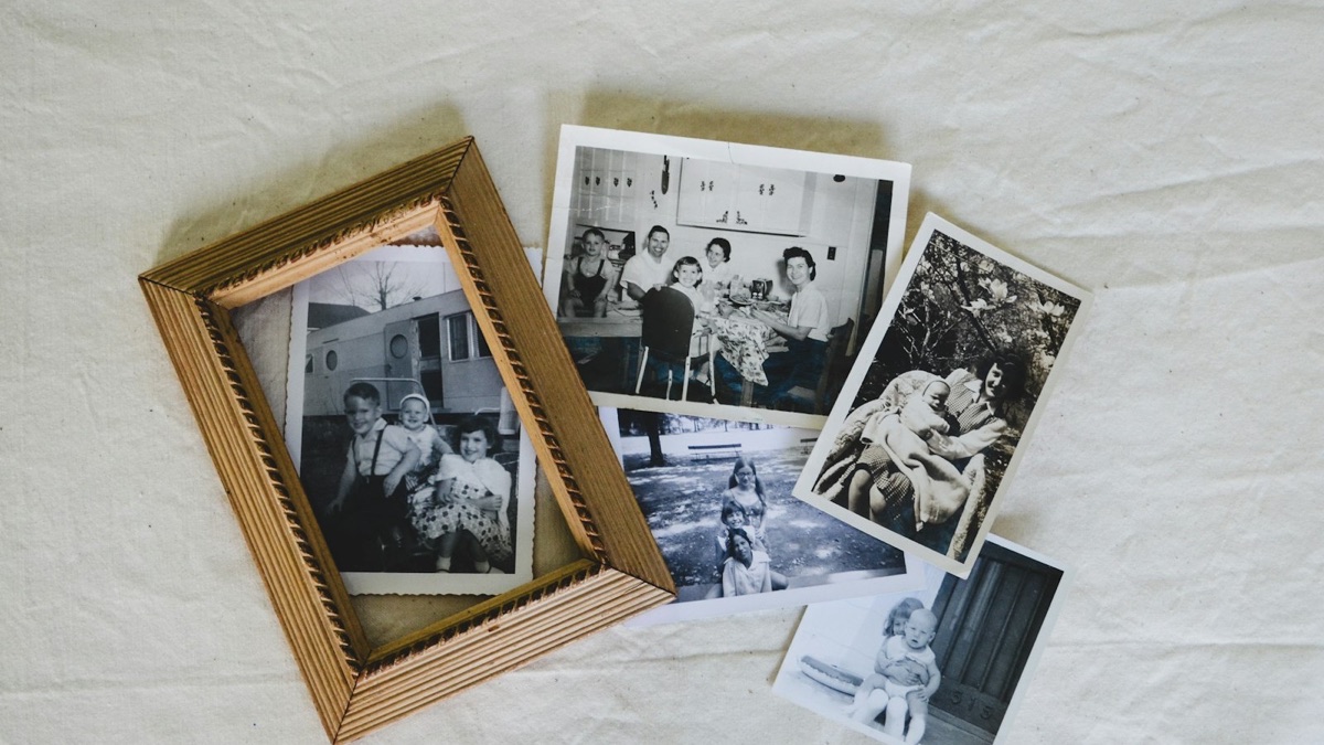 Scenario photo: old printed family photos laid out on a table